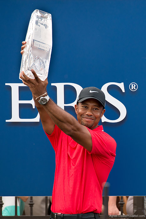 Tiger Woods holding the The 2013 PLAYERS Championship trophy by Agnes Lopez