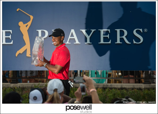 Tiger Woods holding the Players Championship trophy - photo by Agnes Lopez