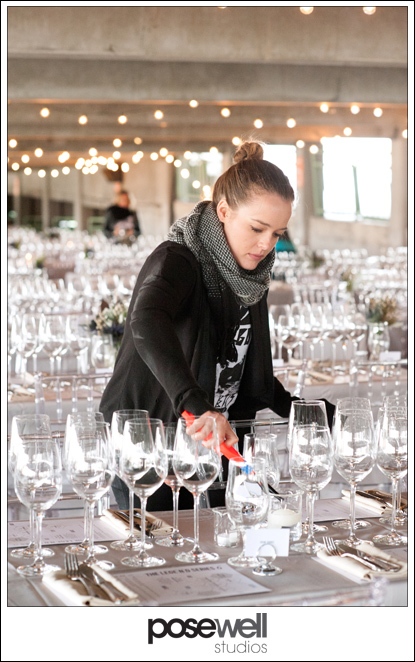 Legend Series staff lighting the candles at the tables